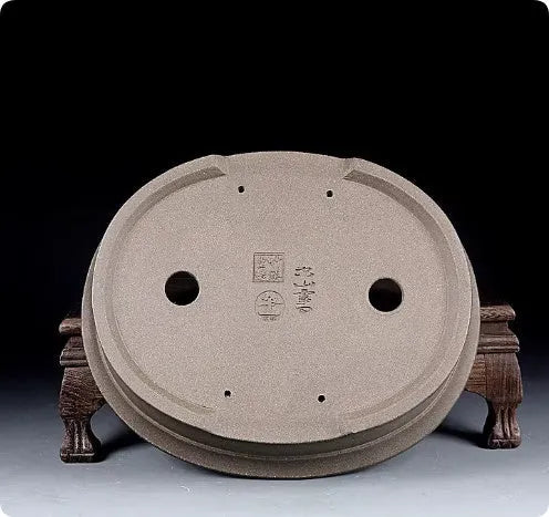 Handmade antique oval purple sand ceramic bonsai pot measuring 25cm by 21cm by 6.3cm