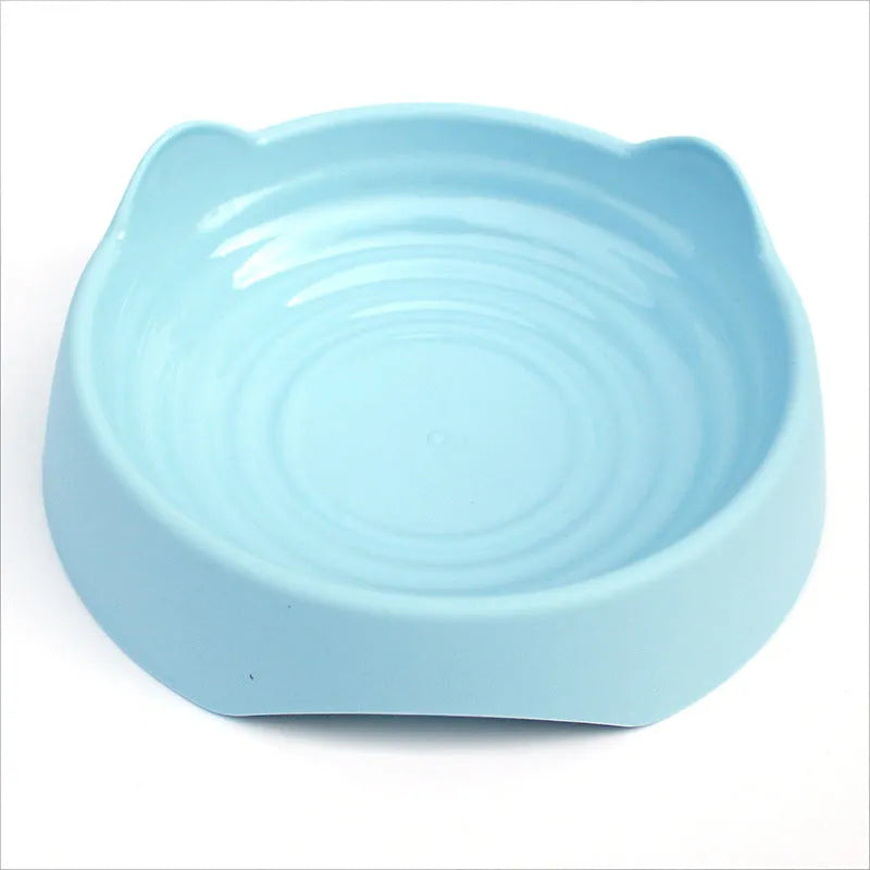 Ceramic dog slow feeder bowl with raised maze pattern in blue, green, or pink colours
