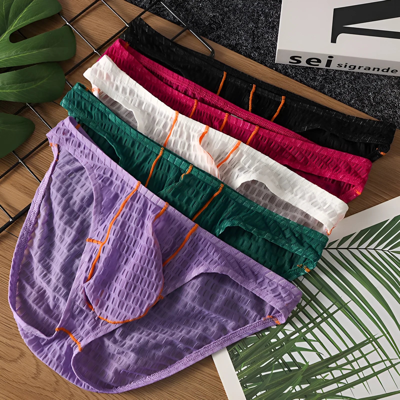 Men's low waist lace briefs in five colours: white, black, green, rose red, and light purple