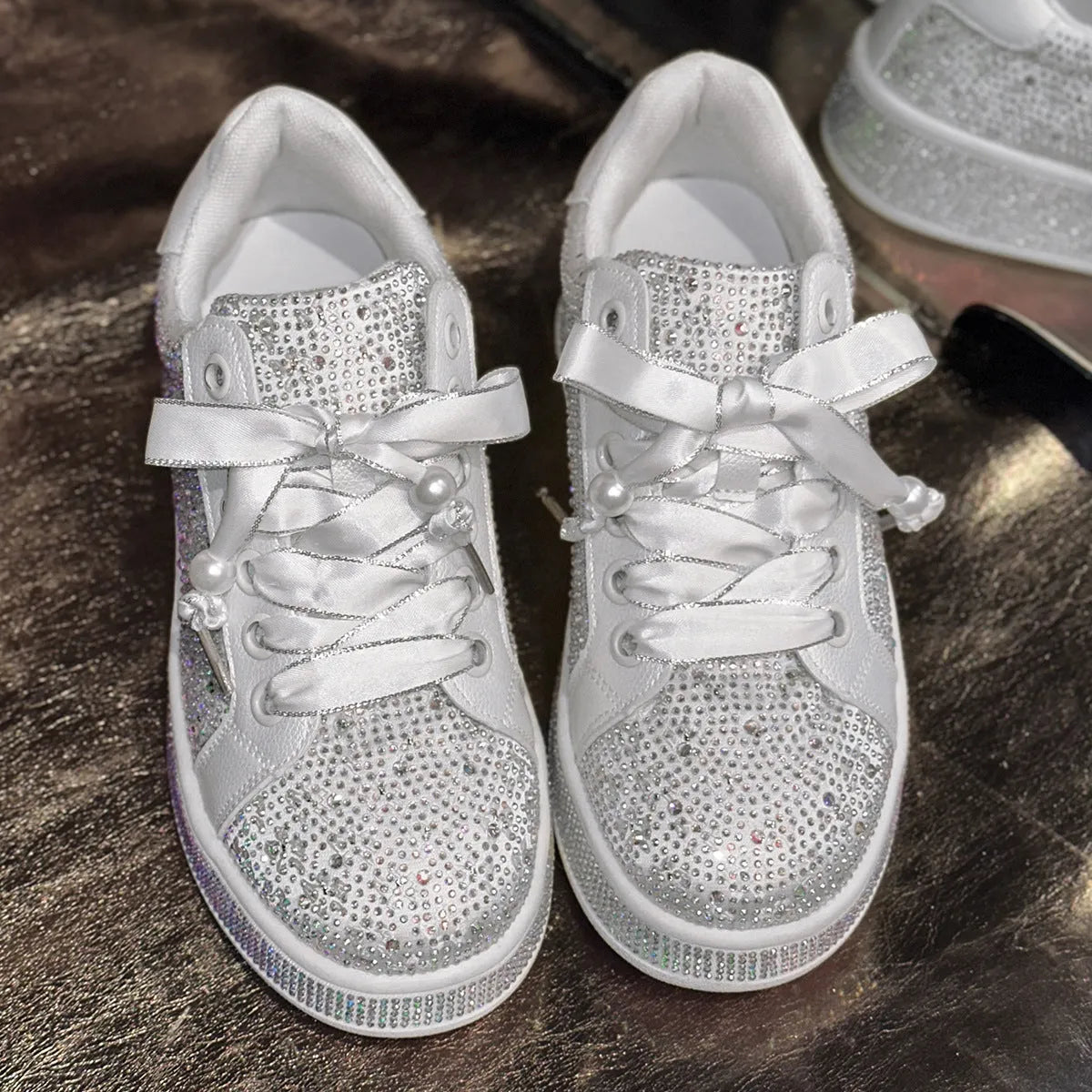 Solid white plus size women's casual shoes with starry rhinestone detailing, low-top design, and rubber sole
