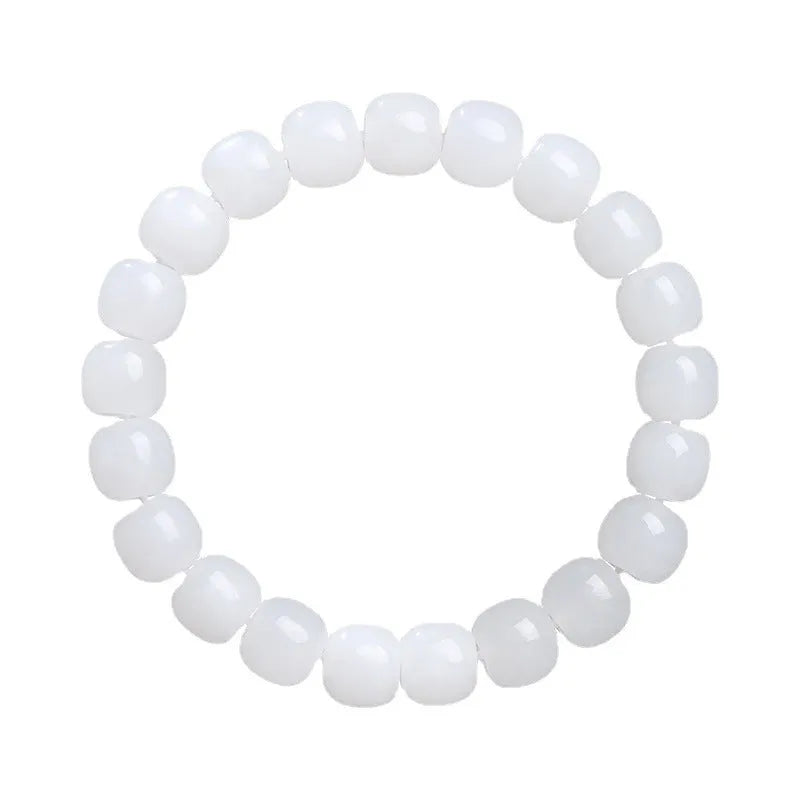 White Hetian jade barrel bead bracelet showing smooth pale stone beads in uniform barrel shape