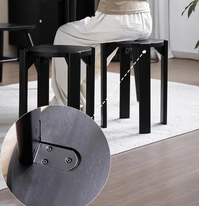 Stackable round metal dining stool in a modern style, shown in a cream white finish.