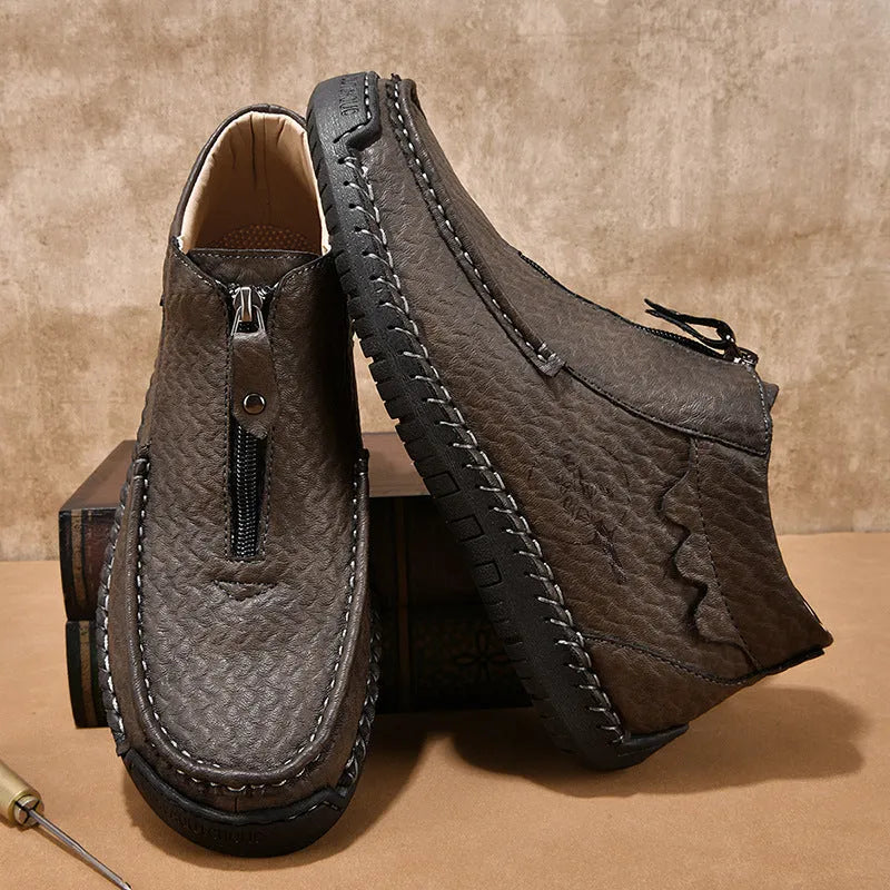 Men's black slip-on casual loafers with round toe and rubber sole on a white background.