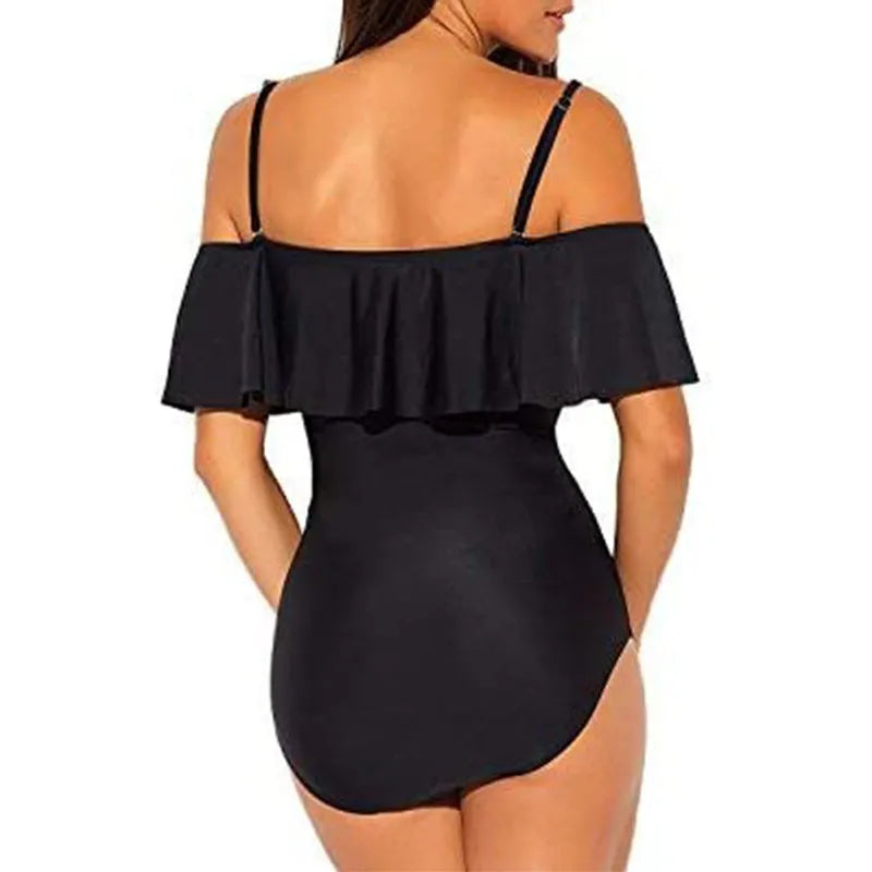 Black one-piece swimsuit with ruffled straps and side cut-out panels on a mannequin.
