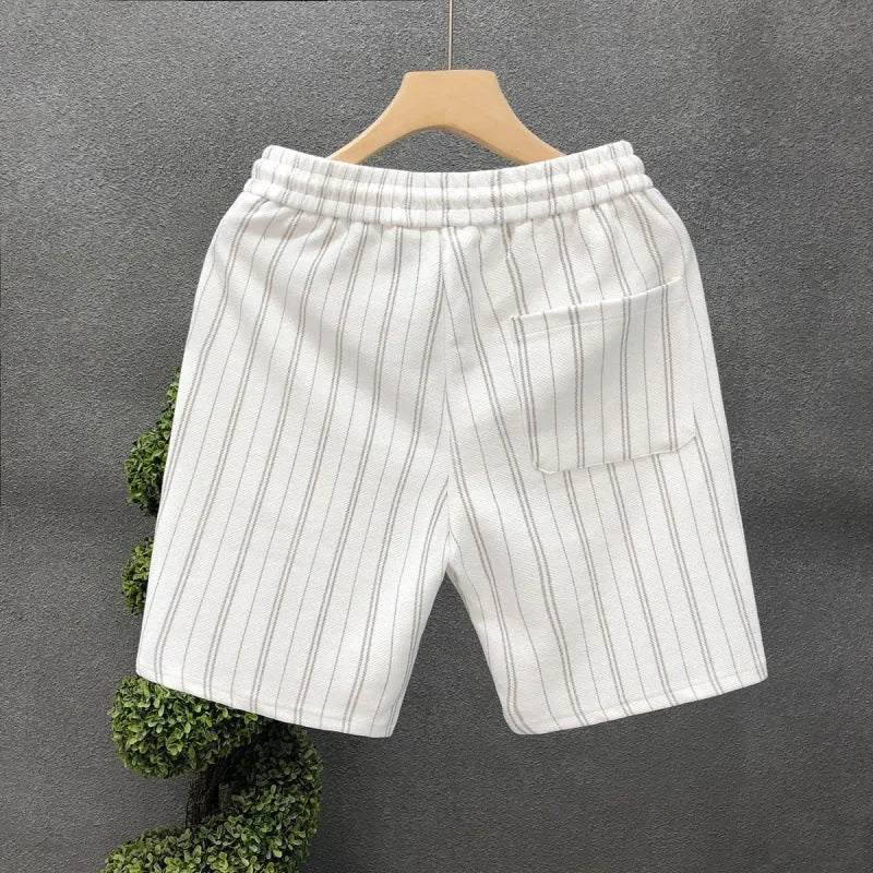 Men's black and white striped fleece-lined casual shorts with elastic waistband showing straight leg ankle banded design