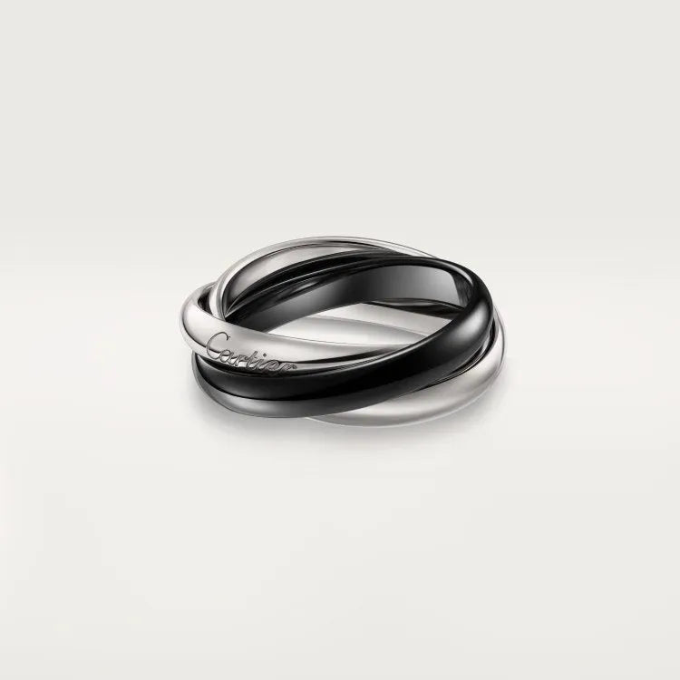 Geometric U-shaped silver couple ring with full diamonds on a black background.