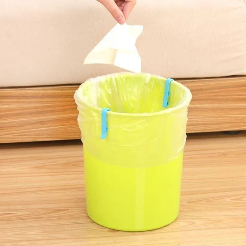 White PP plastic non-slip clip for holding a garbage bag onto a rubbish bin.