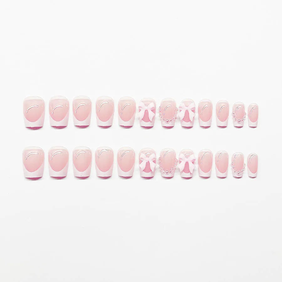 Short French manicure nail art set with multiple patterns including tulips, bows, starry sky, leopard print and XINGX designs
