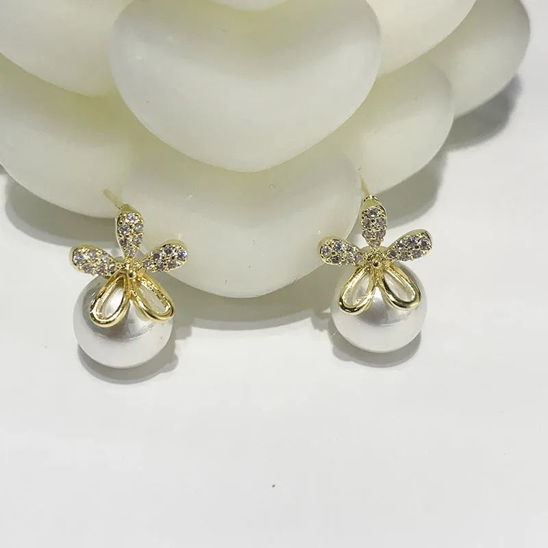 Pearl flower small fragrance earrings in gold and silver with faux pearl centres on alloy metal posts