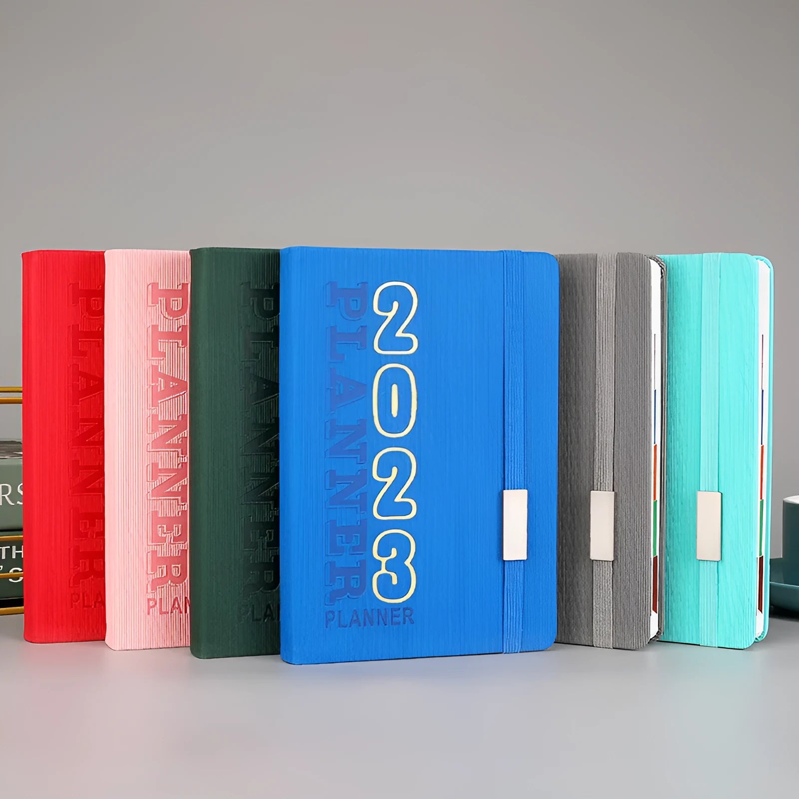 Creative student almanac diary with imitation leather cover open on a schedule page.