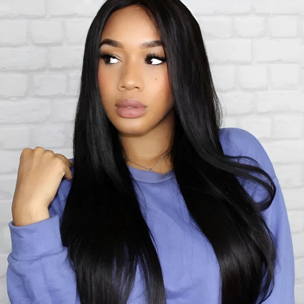 Long straight black synthetic wig with centre parting and fringe on a mannequin head.