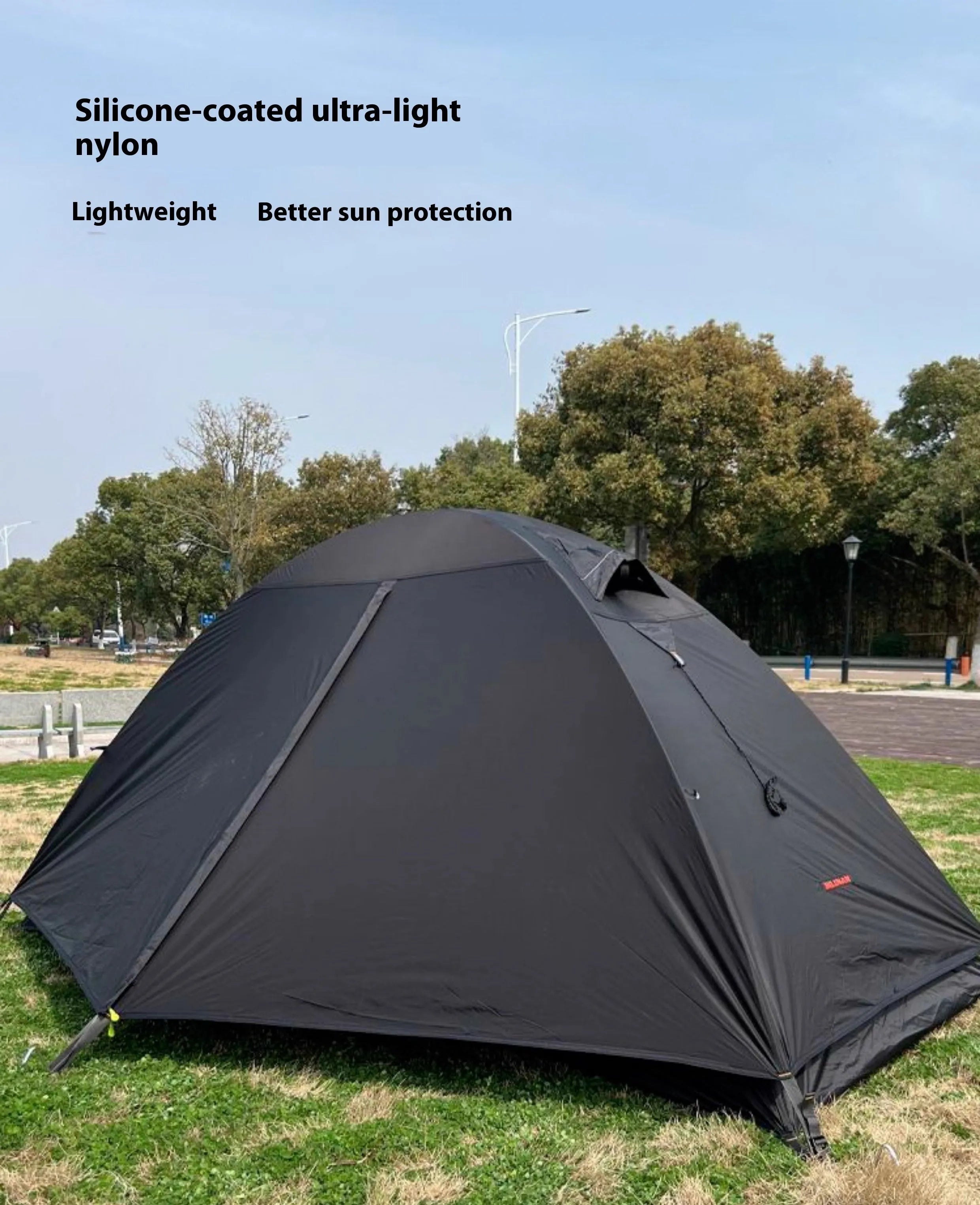 Single person dome tent with aluminum poles in a choice of red, black, or orange colours, shown pitched.