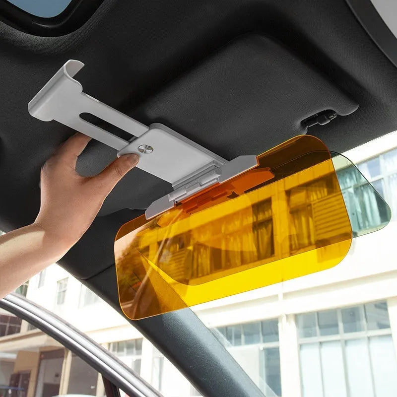 Telescopic anti-glare car sun visor with acrylic lens shown mounted in a vehicle.