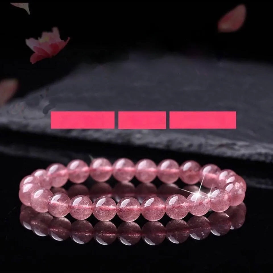 Women's adjustable bracelet made from polished strawberry quartz beads in 6mm, 8mm, or 10mm sizes.