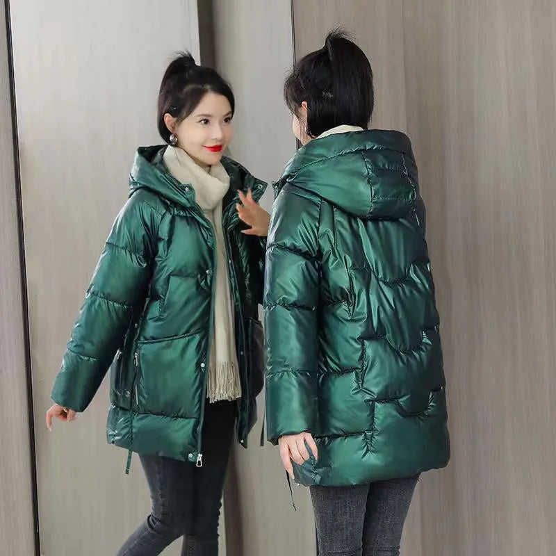 A loose-fitting, hooded winter jacket for women in a thick acrylic blend fabric, shown on a hanger.