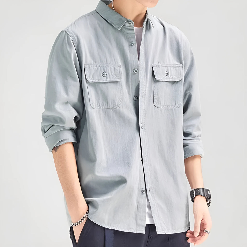 A man's loose-fitting long sleeve cardigan shirt in light grey, black, khaki, or green.