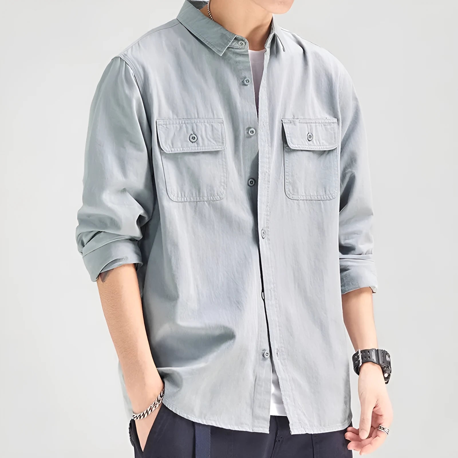 A man's loose-fitting long sleeve cardigan shirt in light grey, black, khaki, or green.