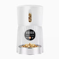 Black and white automatic intelligent pet feeder with digital display and food bowl.