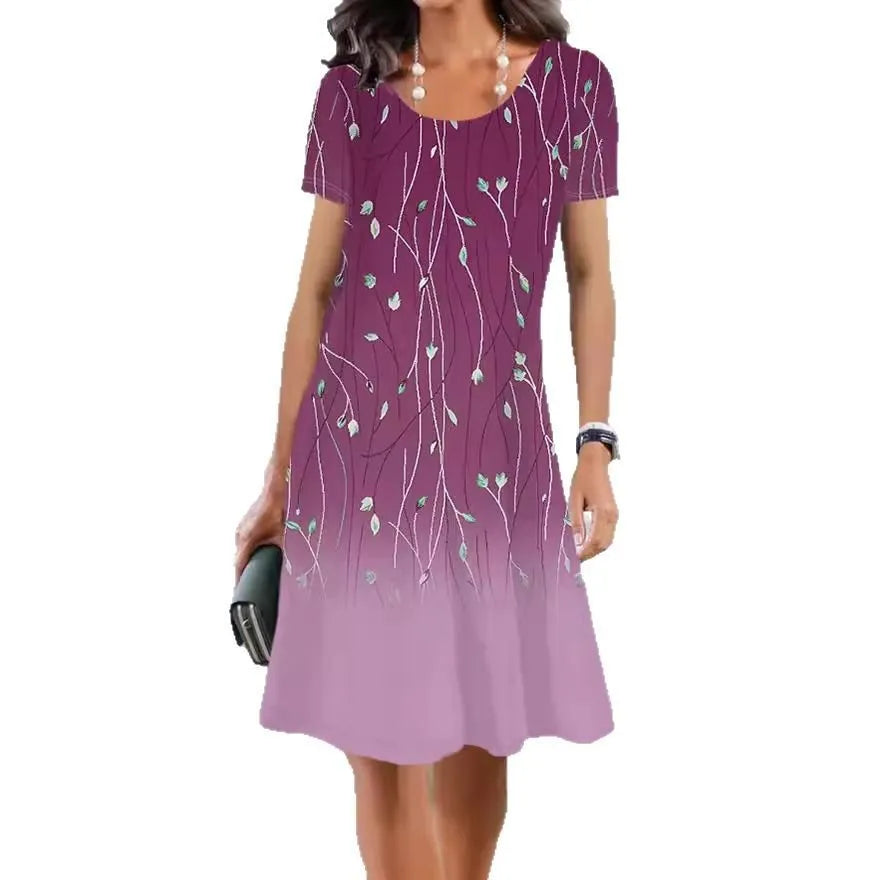 Printed mid-length summer dress with plants and flowers pattern, round neck and short sleeves