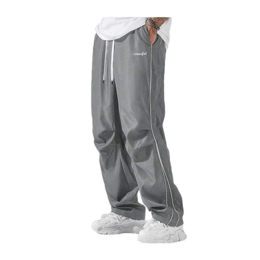 High street charging paratrooper pants for teenagers in straight leg style, available in multiple colours like black and dark green