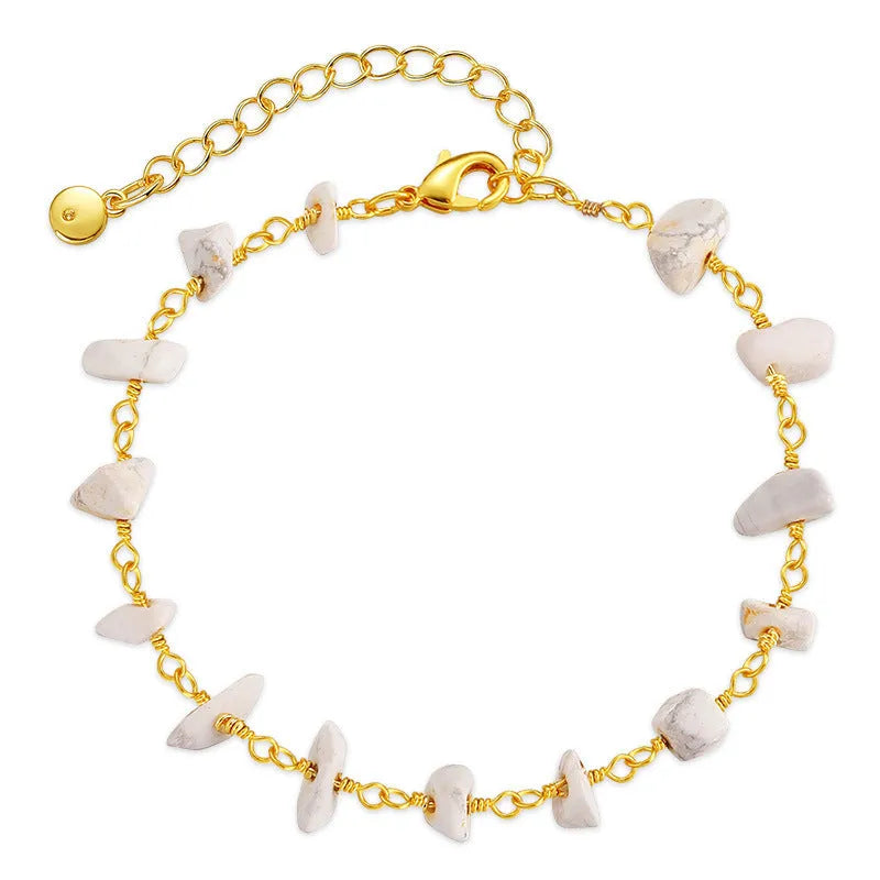 Irregular geometric gravel bracelet with crystal accents in 18K gold plated copper, showing blue colour option
