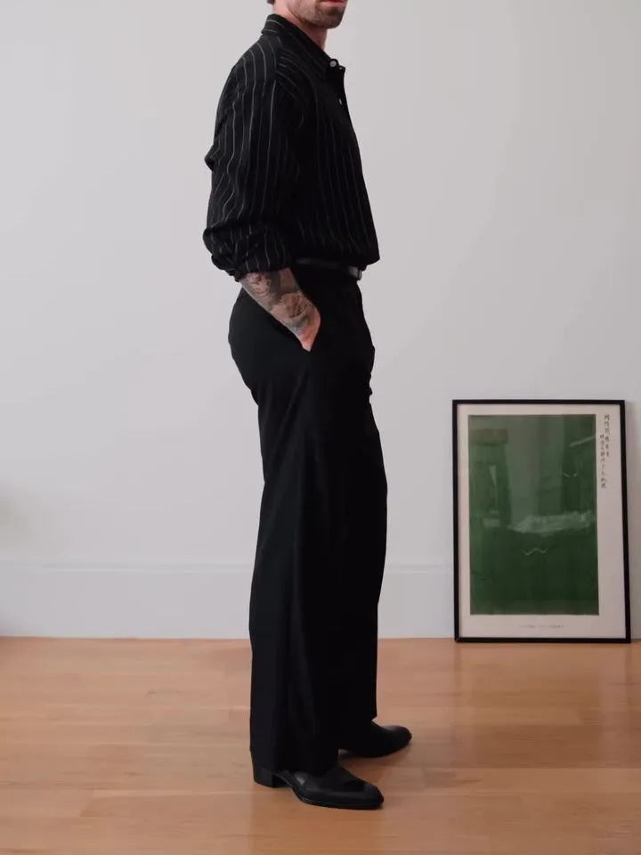 Black pinstriped polyester button-down shirt with collar, shown front view