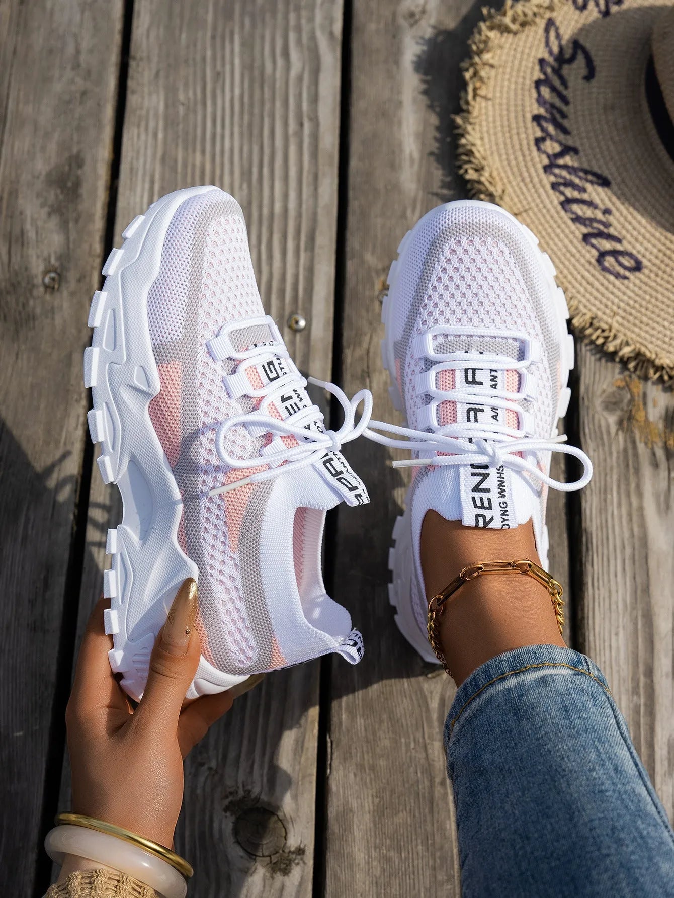Women's Flyknit mesh lace-up sneakers in a multi-tone colourway with a low rubber sole.