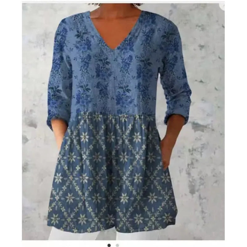 Women's loose fitted printed wave dress with 3/4 sleeves and wide waistband on hanger