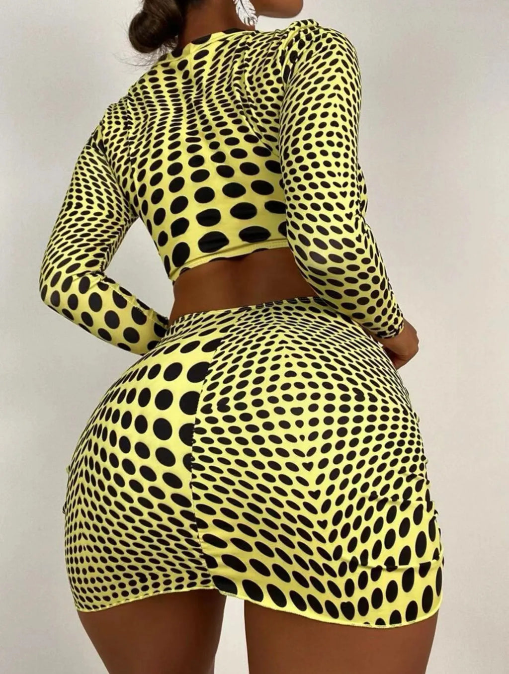 Green and yellow polka dot women's three-piece swimsuit set with bra, bikini top, and skirt.