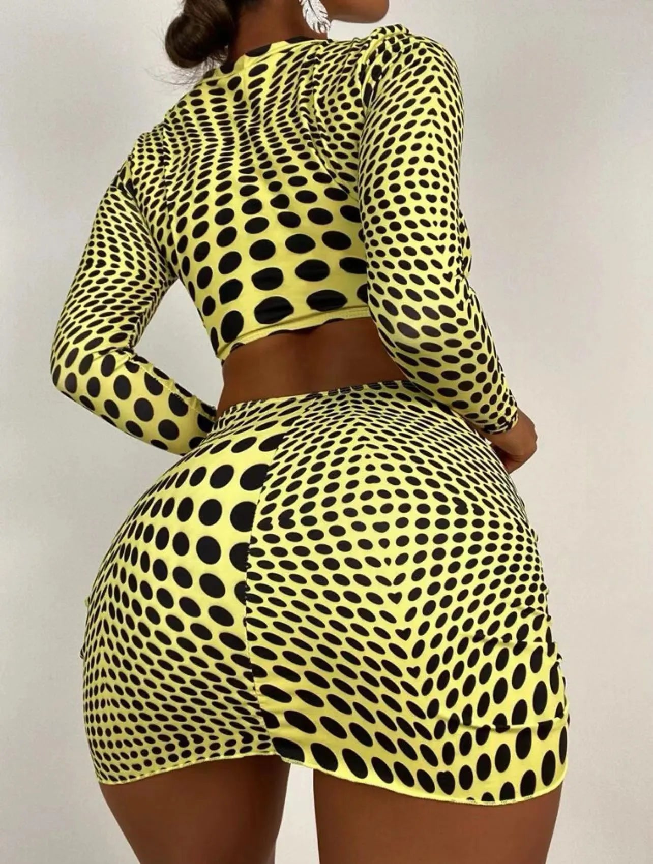Green and yellow polka dot women's three-piece swimsuit set with bra, bikini top, and skirt.