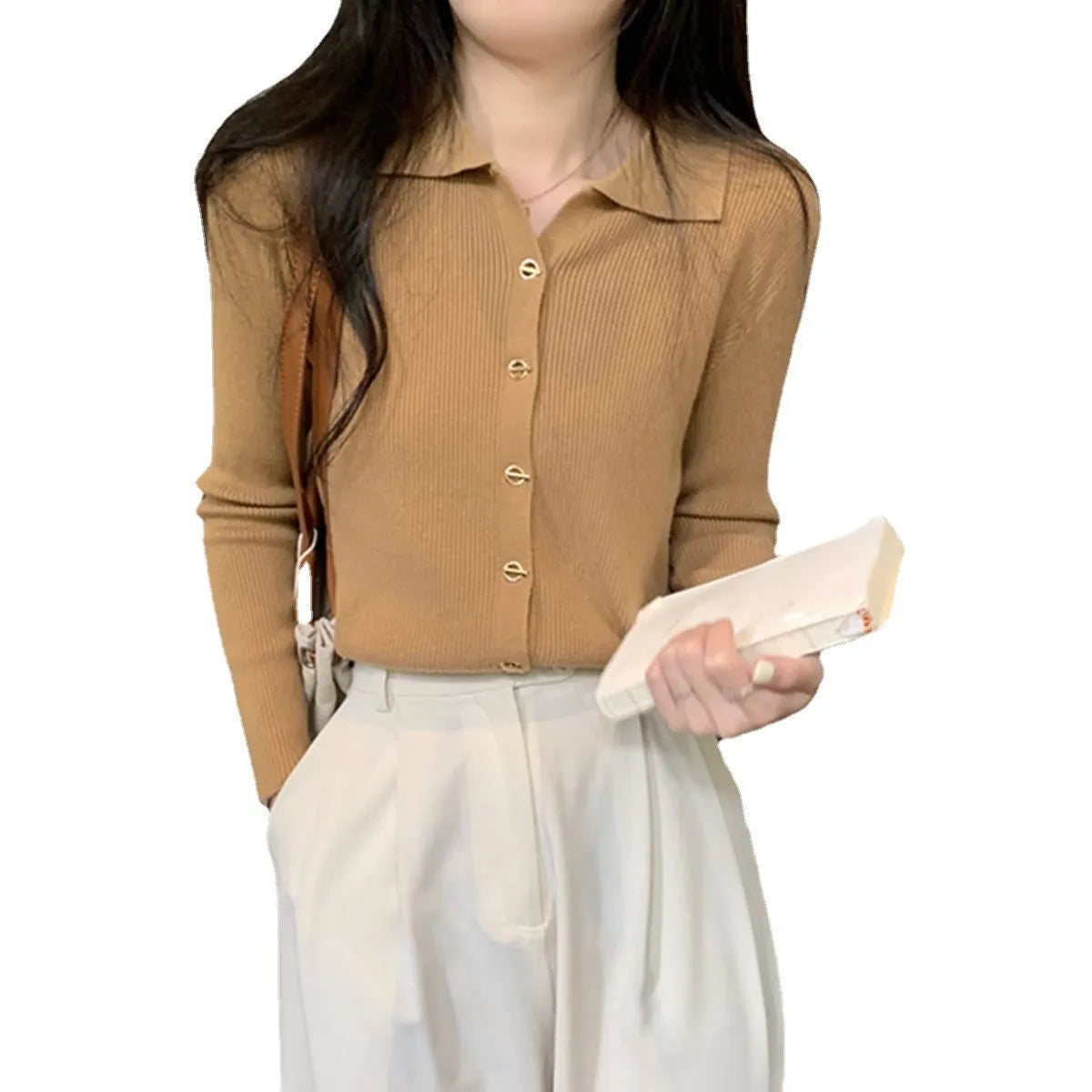 Beige loose fit long-sleeved viscose knitted cardigan for women shown as a layering piece.