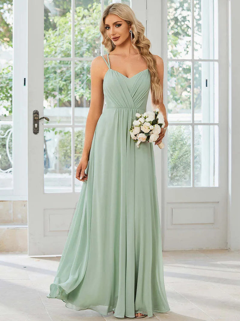 Women's long pleated A-line sleeveless dress in light green polyester fabric