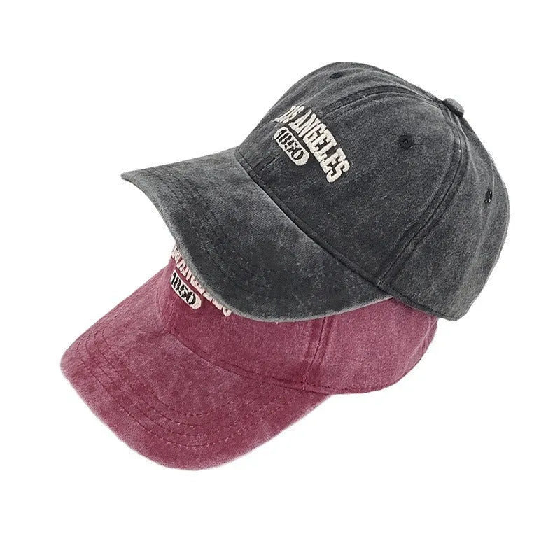 Retro peaked cap with distressed letter embroidery in conical crown style, adjustable 54-59cm fit