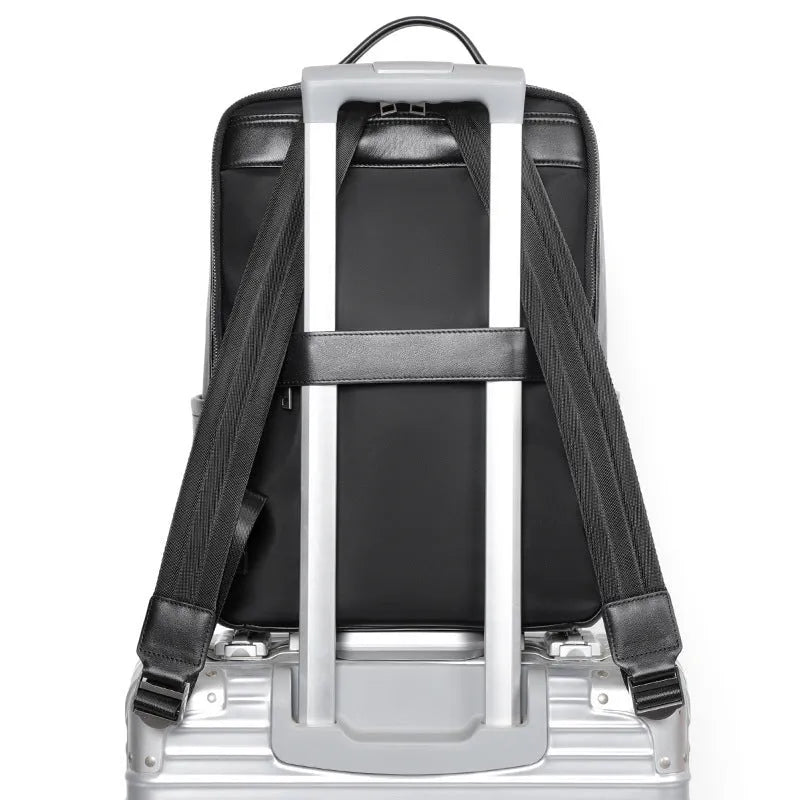 Men's black genuine leather computer backpack with 36-55L capacity for business travel