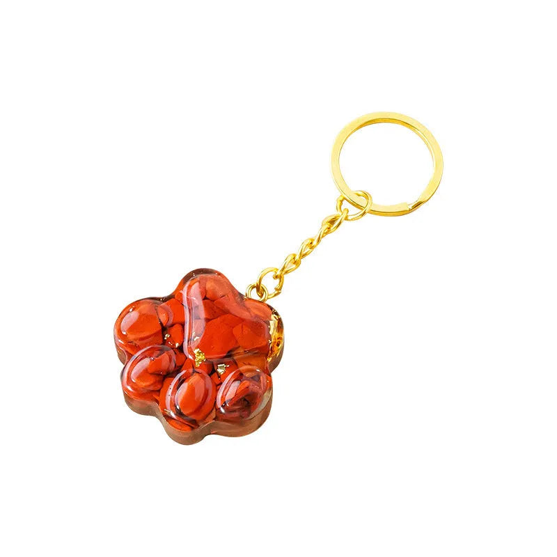Natural crystal cat's paw keychain pendant in various gemstone colours including pink, red, blue and green crystals