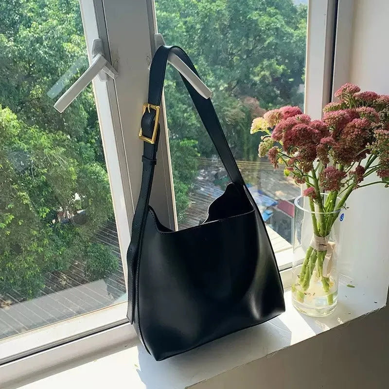 Women's soft PU leather shoulder bag with swing threads in black ribbon and brown with packet styles