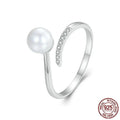 Sterling silver adjustable ring with genuine freshwater shell pearl on minimalist band