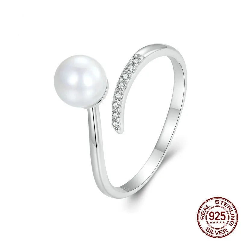 Sterling silver adjustable ring with genuine freshwater shell pearl on minimalist band