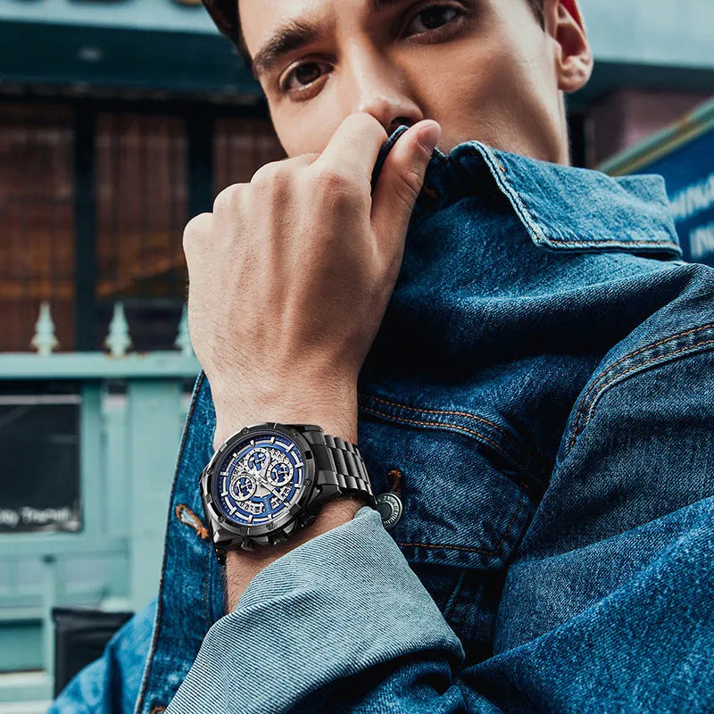 Men's stainless steel casual watch with luminous hands on wrist, showing blue dial and black case option.