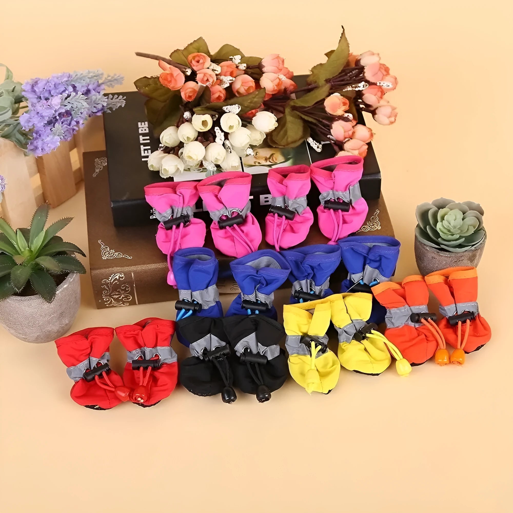 Set of four breathable cloth dog shoes with soft soles, shown in a choice of colours and patterns.