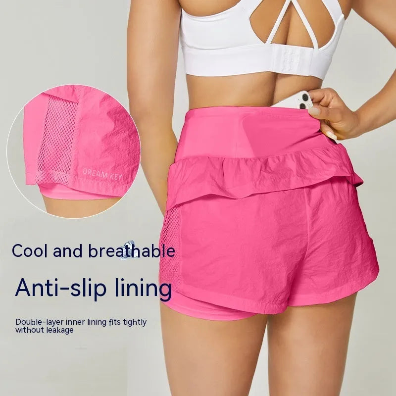 Women's loose cotton blend quick-drying sports shorts in lemon yellow colour.