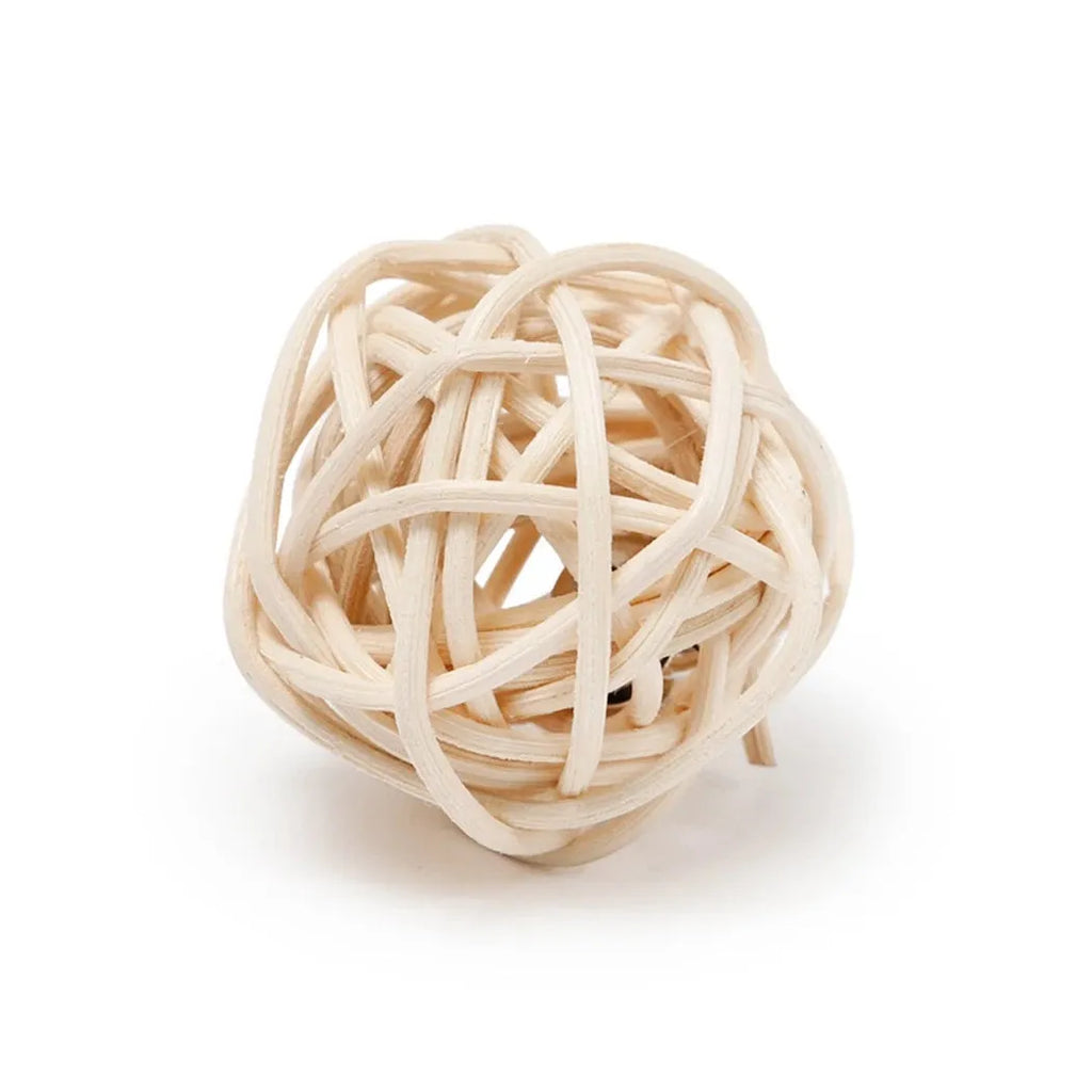 Two cat toys: a hollow rattan ball and a faux feather ball on a plain background