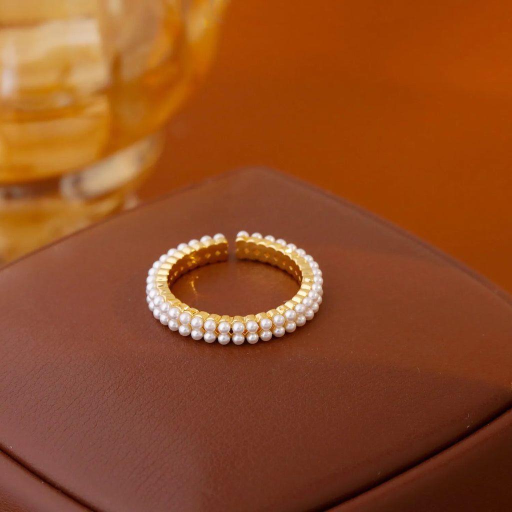 Gold geometric open mouth women's ring with pearl detailing on copper base