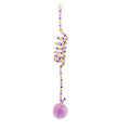 Spring cat toy with coloured inflatable ball and bell hanging from suction cup on glass door