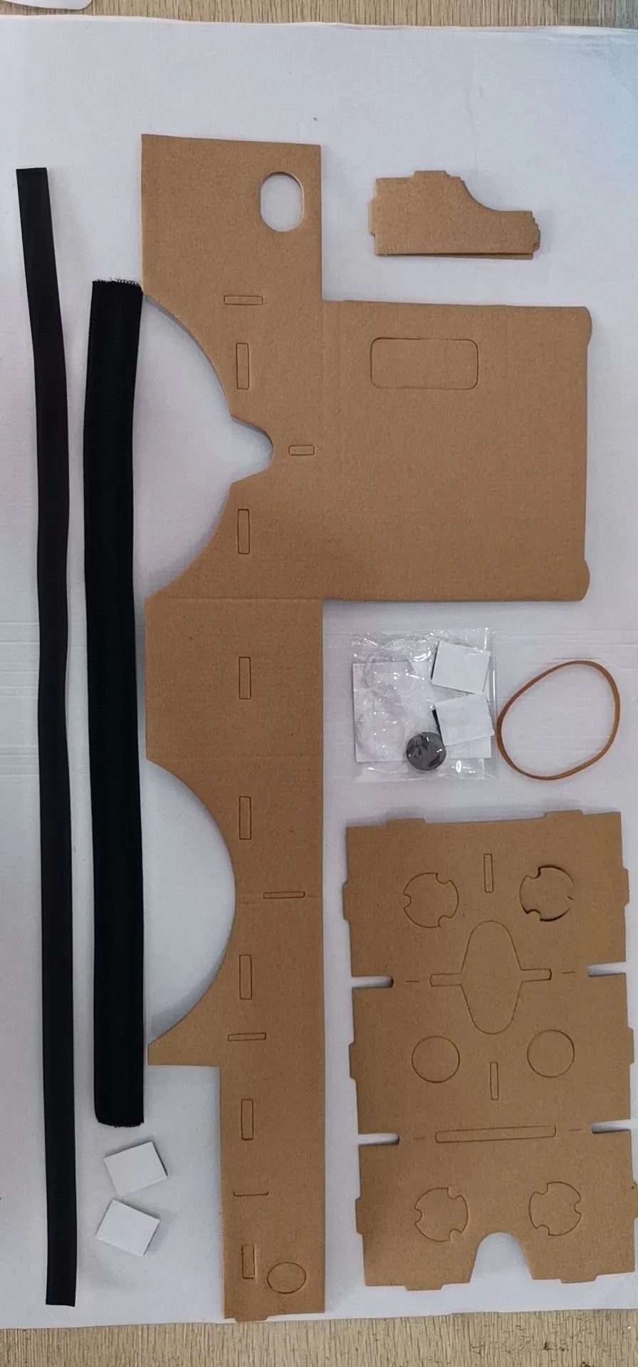Pink and white cardboard VR glasses for smartphones with 3D lenses and magnet control