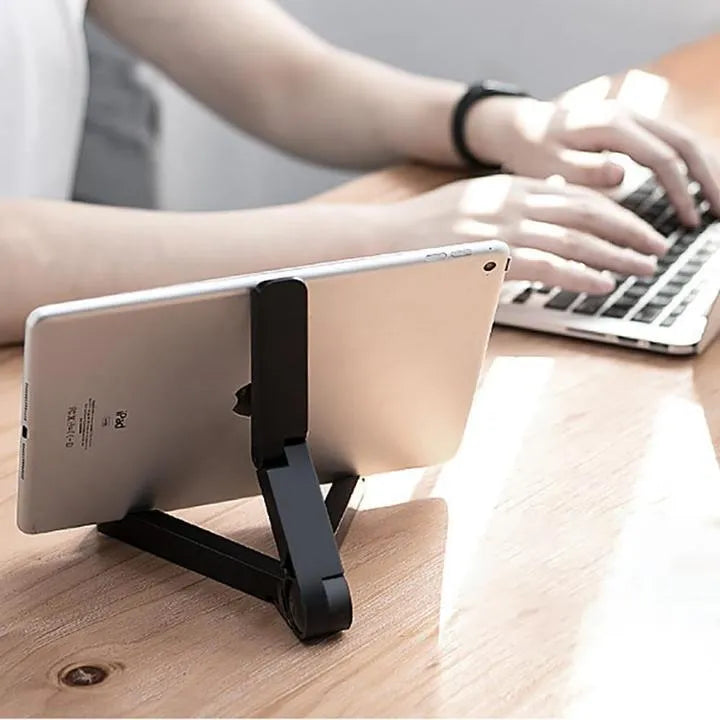 Foldable tablet holder in black showing adjustable angle stand for phone or tablet
