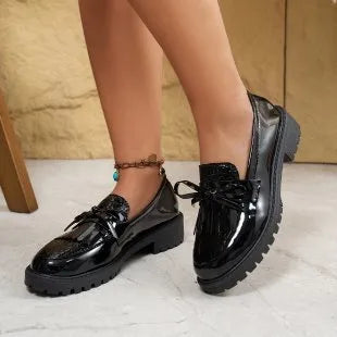 Women's black loafers with decorative bow detail for spring and autumn seasons