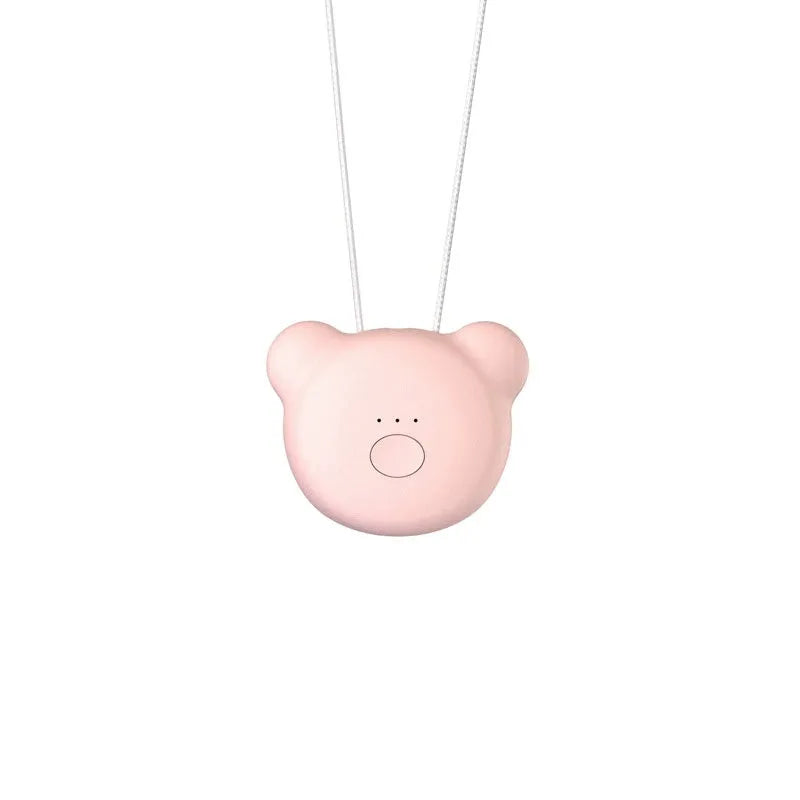 Mini USB portable air purifier necklace in pink, showing compact design with single button.