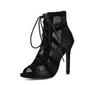 Black suede women's lace-up high heel shoes with 11.5cm heel shown from side view