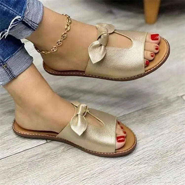 Women's black fish mouth slipper sandals with a decorative bow on the artificial PU upper.